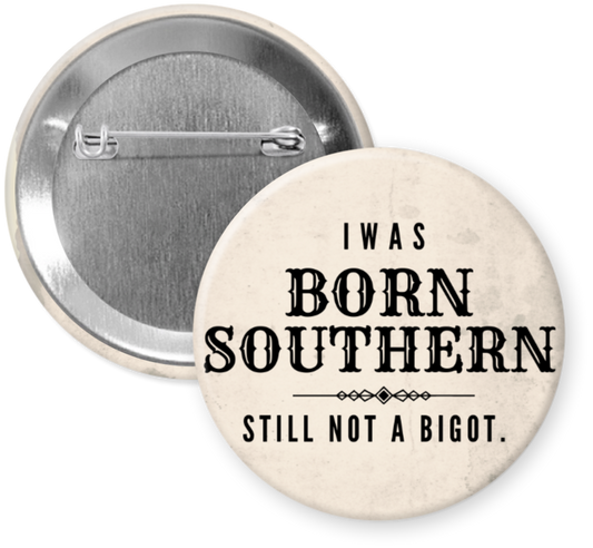 2.25 inch button reading Born Southern Still Not A Bigot in black text on a neutral background