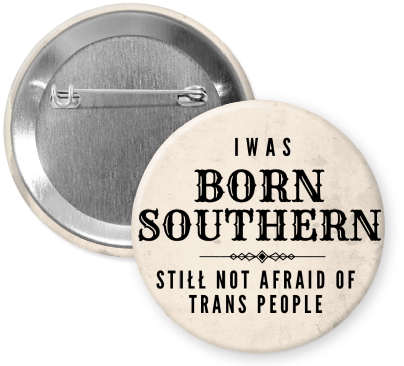 2.25 inch button reading Born Southern Still Not Afraid of Trans People in black text on a neutral background
