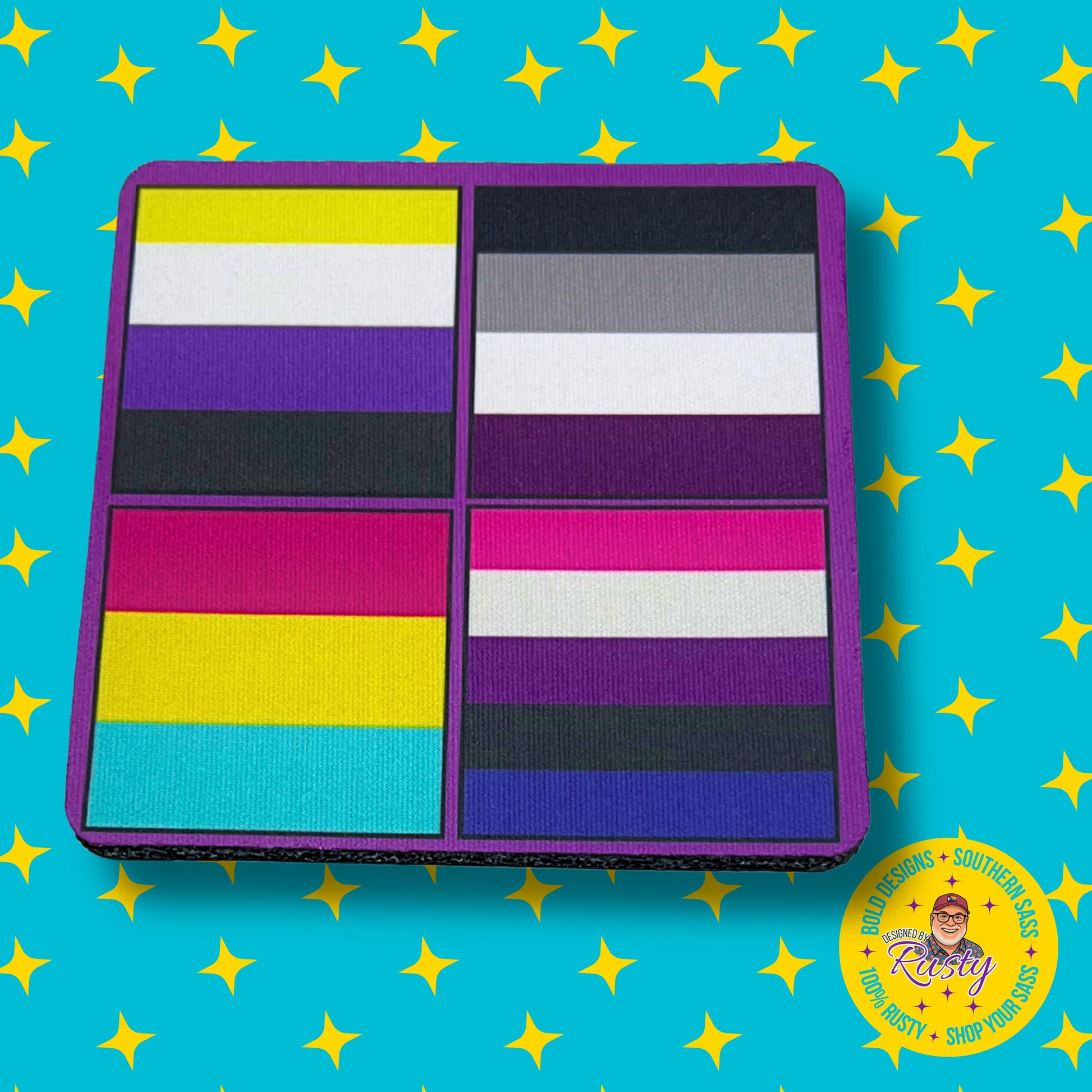 Colorful coaster with LGBTQ+ pride flag designs on purple border, displayed on turquoise background with Designed by Rusty logo.
