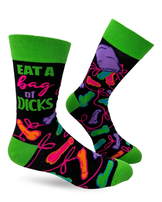 Black crew socks with neon green cuff and colorful cartoon dicks with the phrase “Eat a bag of dicks”
