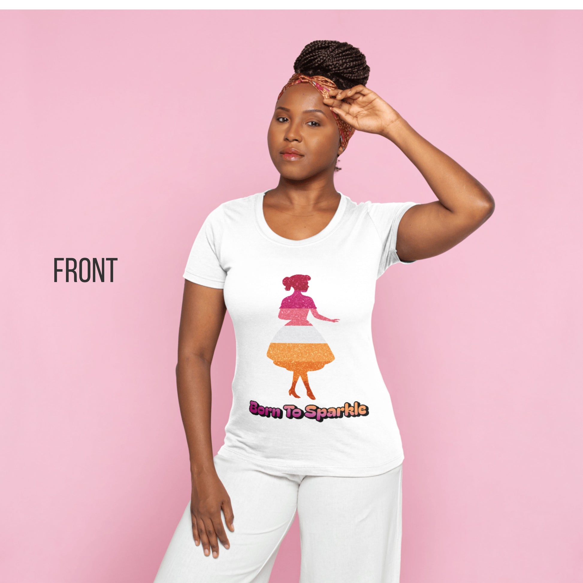 Woman modeling white T-shirt with glitter silhouette design and “Born to Sparkle” text, standing against a pink background.