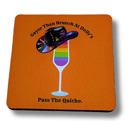 Orange coaster with rainbow mimosa glass and sequin cowboy hat, reading “Gayer Than Brunch at Dolly’s – Pass The Quiche,” displayed against a plain white background.