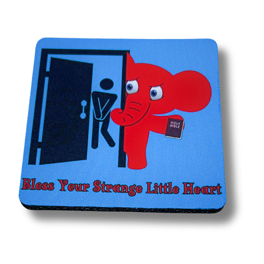 Blue coaster with red elephant holding a Bible next to restroom door, bold text reading “Bless Your Strange Little Heart,” displayed on white background.
