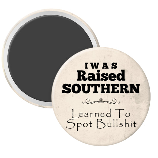 Round magnet with text 'I Was Raised Southern Learned To Spot Bullshit' on a white background