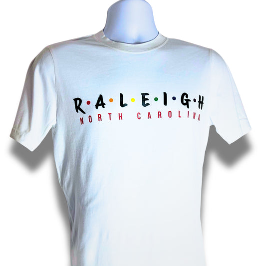 White t-shirt with 'RALEIGH NORTH CAROLINA' text on a mannequin against a white background