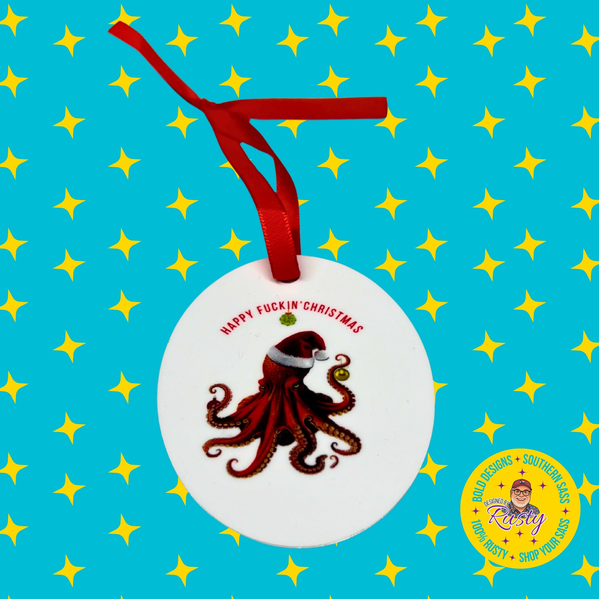 Red octopus Santa ornament with red ribbon shown on a turquoise Designed by Rusty branded background with yellow stars.
