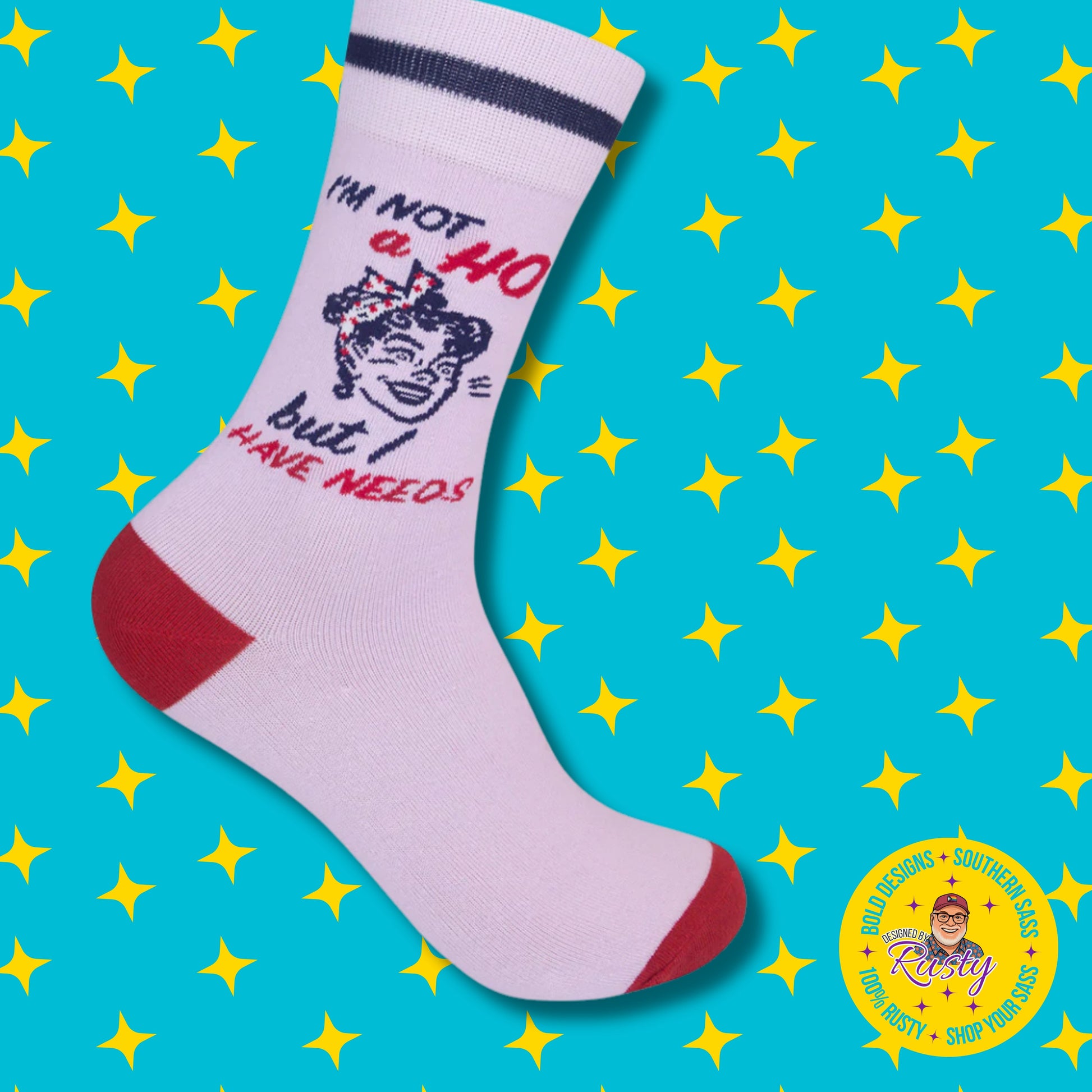 White crew socks with red accents and retro graphic text on turquoise background with yellow stars and Designed by Rusty logo.