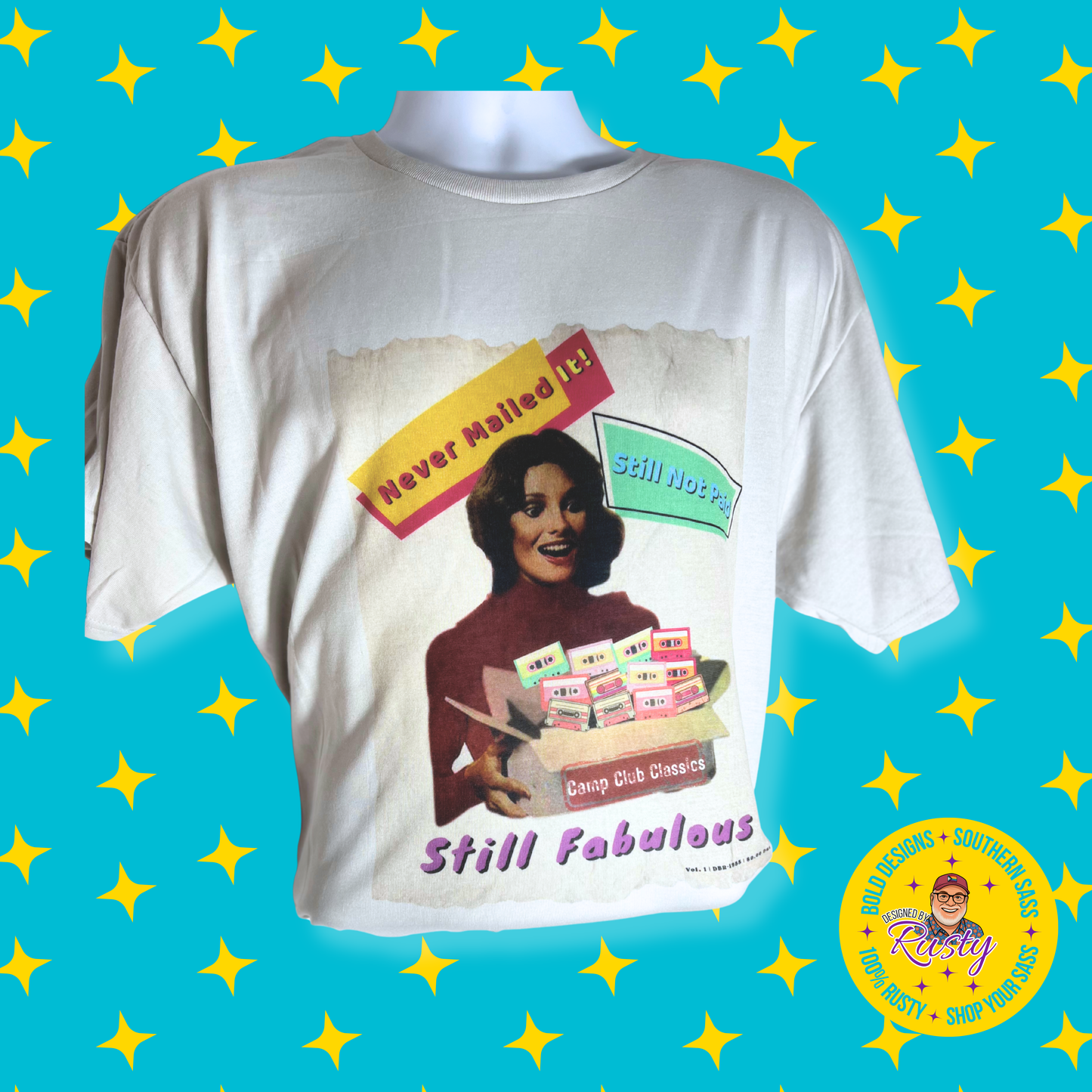 Silver t-shirt with vintage-style graphic design on a blue background with yellow stars with designed by rusty logo.